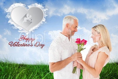 Composite image of affectionate man offering his partner roses