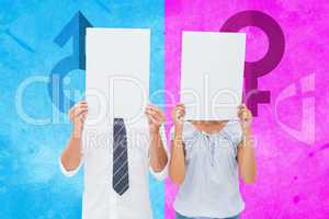 Composite image of couple holding paper over their faces