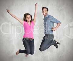 Composite image of cheerful young couple jumping