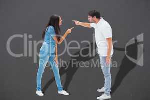 Composite image of angry couple shouting at each other