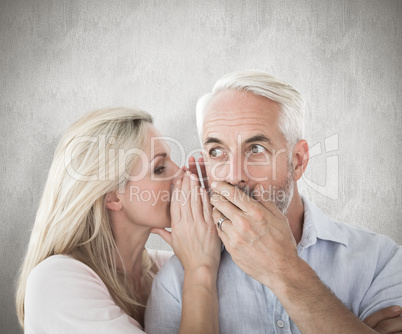 Composite image of woman whispering a secret to husband