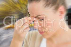 Composite image of woman with headache