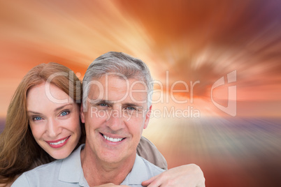 Composite image of casual couple hugging and smiling