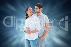 Composite image of cute couple embracing and smiling at each oth