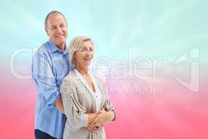 Composite image of happy mature couple embracing each other