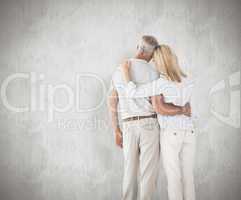 Composite image of happy couple standing and looking