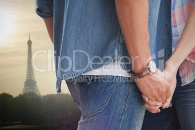 Composite image of hip young couple holding hands