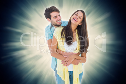 Composite image of happy casual couple smiling and hugging