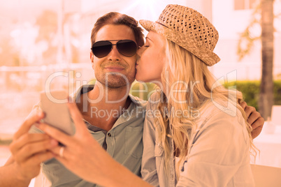 Hip young couple taking a selfie together