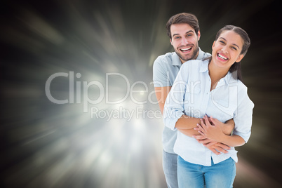 Composite image of cute couple hugging and smiling at camera