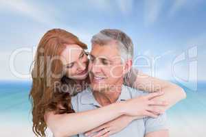 Composite image of casual couple hugging and smiling