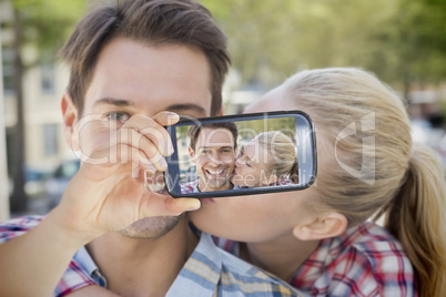 Couple taking selfie on smartphone