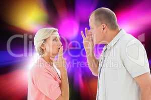 Composite image of older couple holding hands to mouth for silen