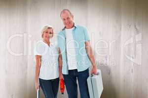 Composite image of happy older couple holding diy tools