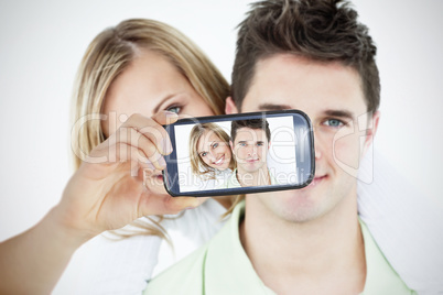 Couple taking selfie on smartphone