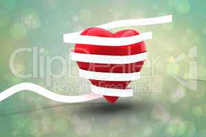 Composite image of love heart wrapped in ribbon