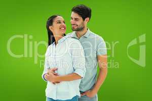 Composite image of cute couple embracing and smiling at each oth