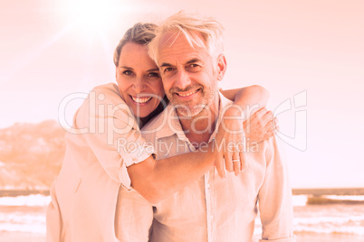 Attractive married couple posing at the beach