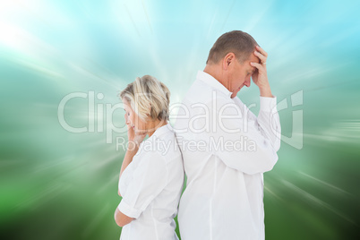 Composite image of upset couple not talking to each other after