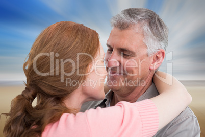 Composite image of casual couple hugging and smiling