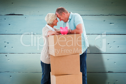 Composite image of older couple smiling at each other with movin