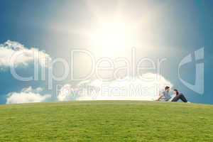 Composite image of couple sitting on the floor