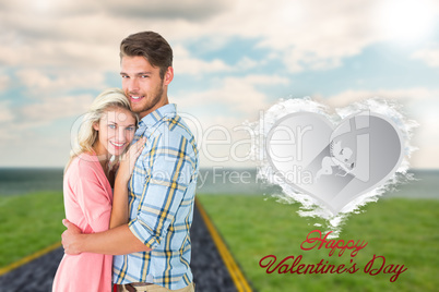 Composite image of attractive couple embracing and smiling at ca Composite image of attractive couple embracing and smiling at ca