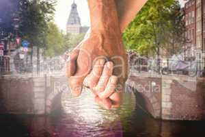 Composite image of happy senior couple holding hands