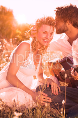 Handsome man serenading his girlfriend with guitar Handsome man serenading his girlfriend with guitar