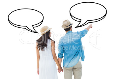 Composite image of happy hipster couple holding hands and lookin