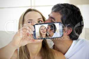 Couple taking selfie on smartphone