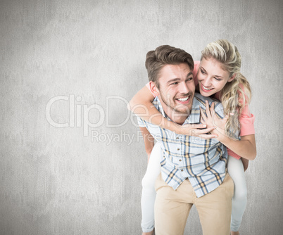 Composite image of handsome man giving piggy back to his girlfri Composite image of handsome man giving piggy back to his girlfri