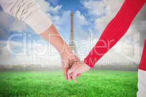 Composite image of couple holding hands rear view