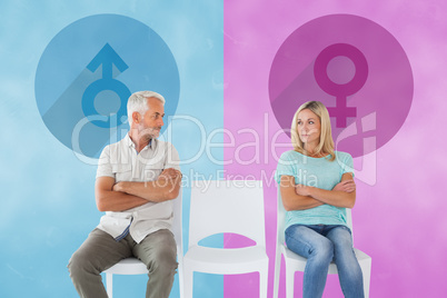 Composite image of unhappy couple not speaking to each other