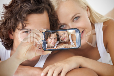 Couple taking selfie on smartphone