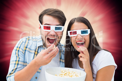 Composite image of attractive young couple watching a 3d movie