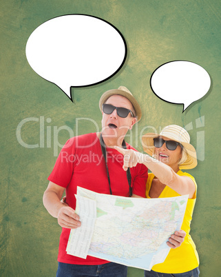 Composite image of happy tourist couple using map
