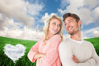 Composite image of attractive couple smiling with arms crossed