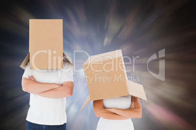 Composite image of mature couple wearing boxes over their heads