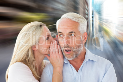 Composite image of woman whispering a secret to husband