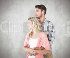 Composite image of attractive young couple embracing and smiling