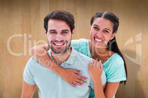 Composite image of cute couple smiling at camera