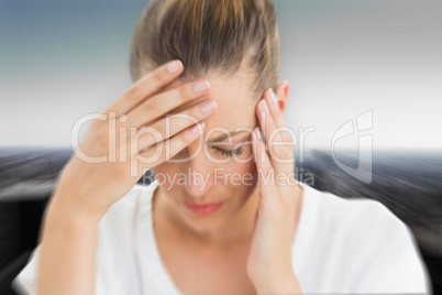 Composite image of woman with headache