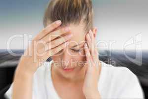 Composite image of woman with headache