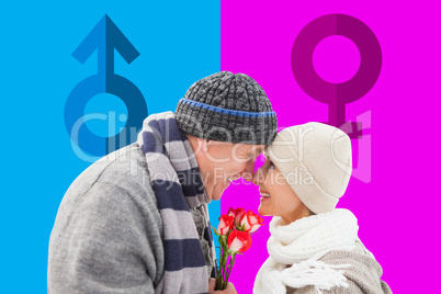 Composite image of happy mature couple in winter clothes with ro