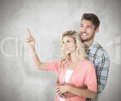 Composite image of attractive young couple embracing and looking