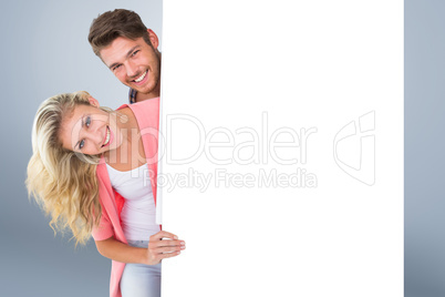 Composite image of attractive young couple smiling at camera