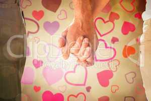 Composite image of happy senior couple holding hands