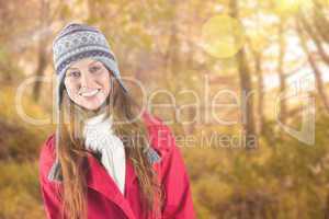 Composite image of pretty redhead in warm clothing