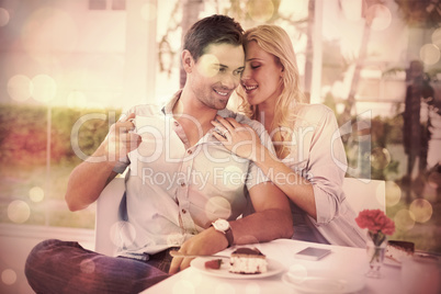 Hip young couple enjoying coffee and desert together